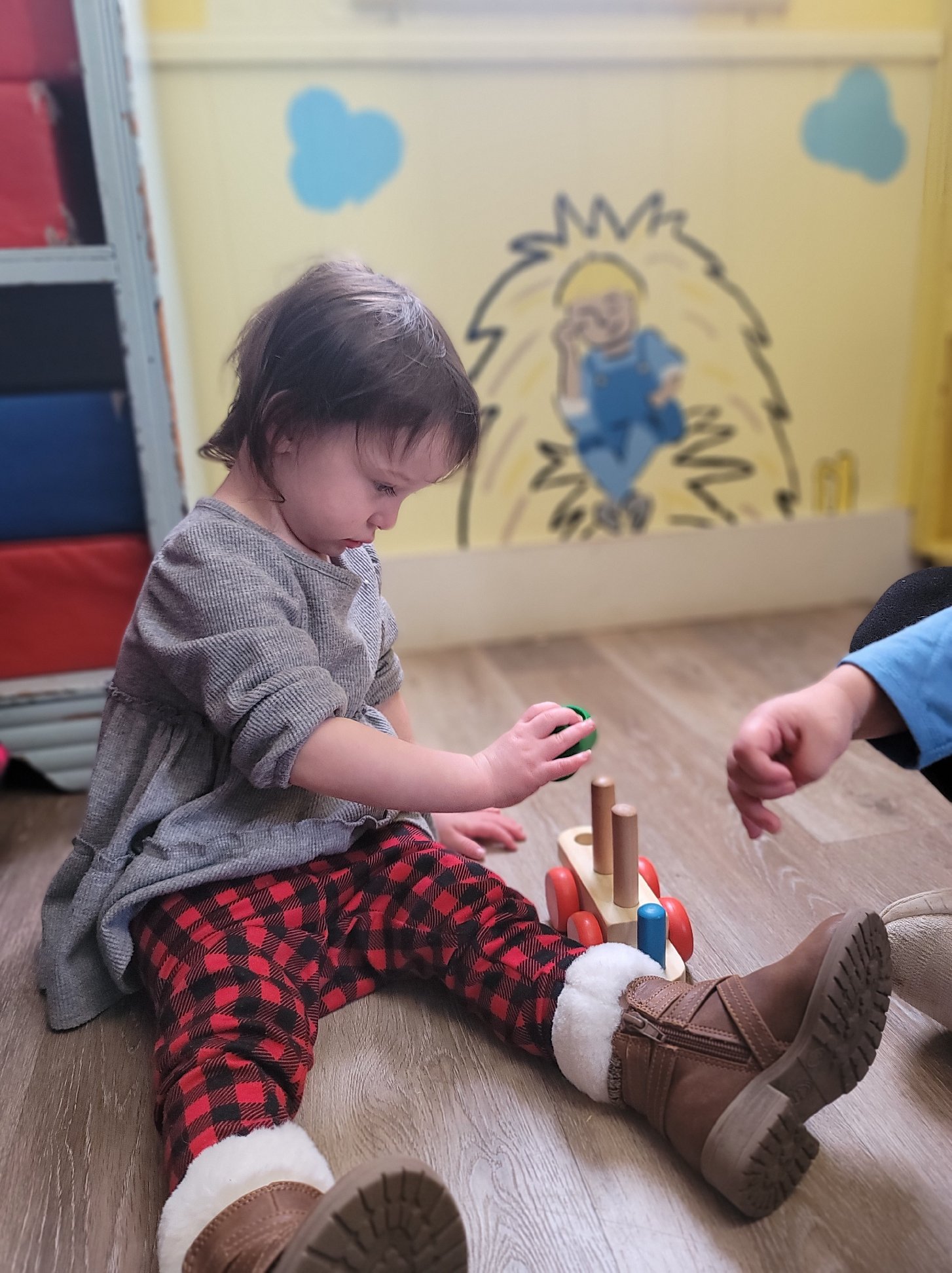 Johnson’s Day Care & Cradle Care in Muscle Shoals, AL Child playing inside at Johnson’s Day Care & Cradle Care in Muscle Shoals, AL